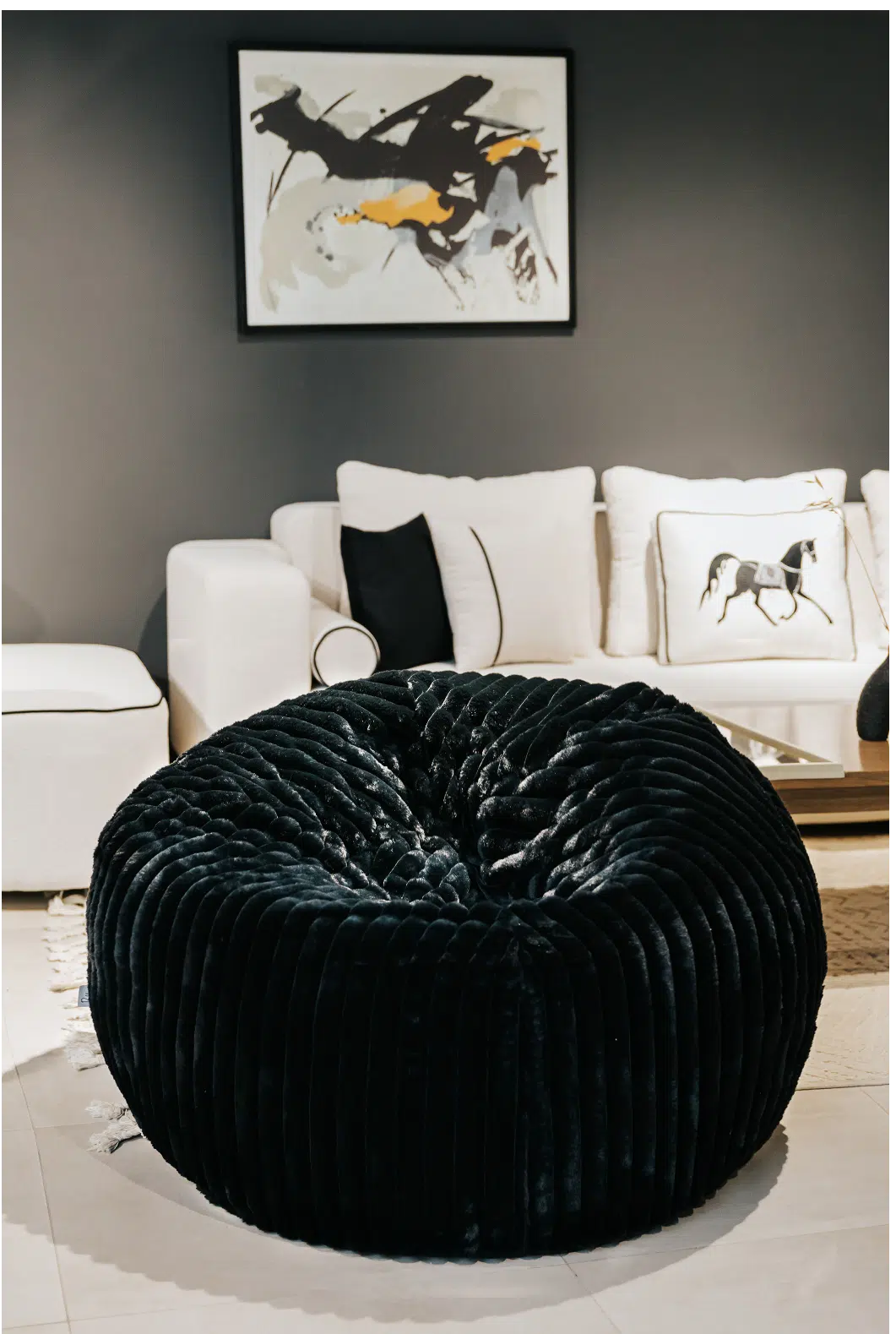 POUF TOUAREG FOURRURE COTELÉE 100*70 – NOIR